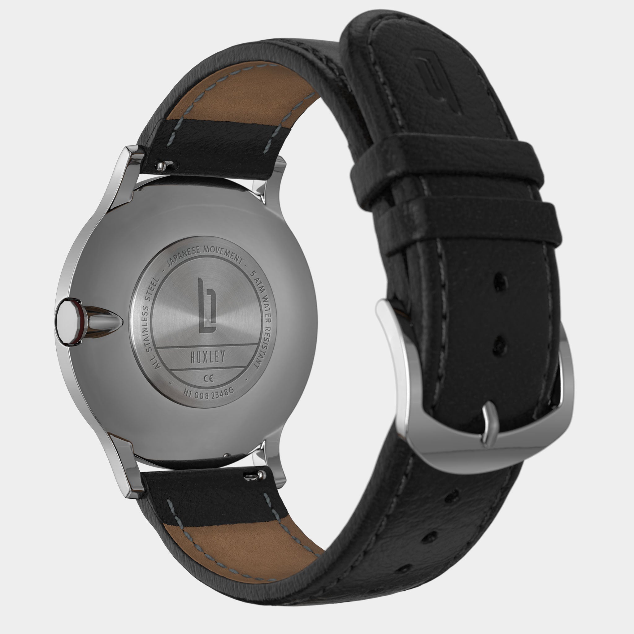 Stainless steel watch back with engraved logo, black leather strap, silver buckle