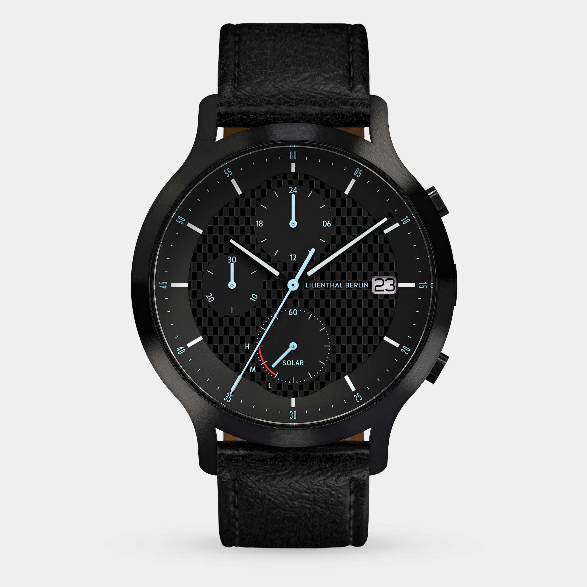 Black chronograph watch with textured dial, date display, solar subdial, and leather strap