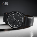 Minimalist black wristwatch with leather strap and date display, German Design Award 2021 winner
