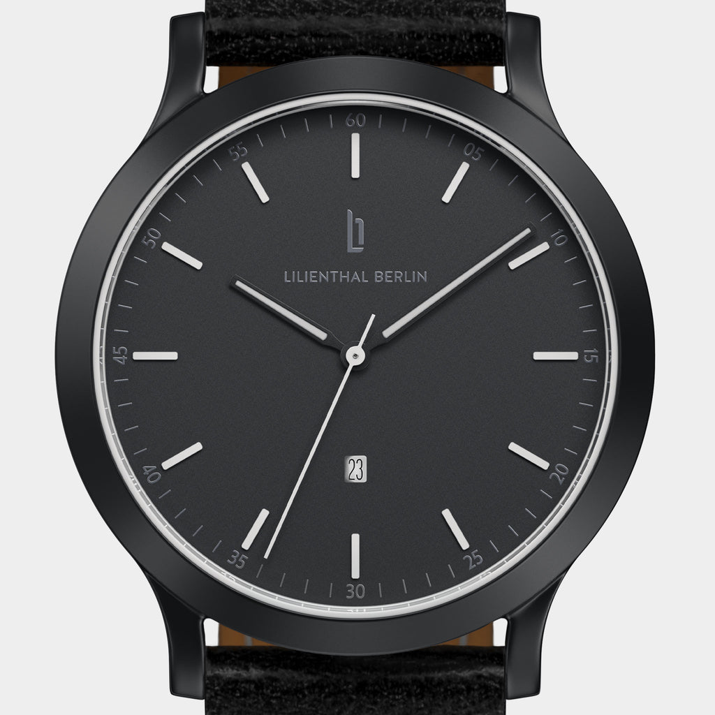 Minimalist black watch with date display and black leather strap