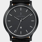 Minimalist black watch with date display and black leather strap